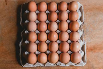 Eggs in carton box on rustic background, bogota colombia, april 4, 2020