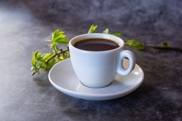 cup of aromatic hot coffee on a dark background flat lay