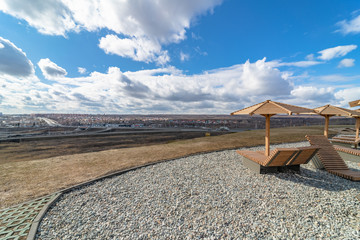 umbrellas and sunbeds on the recreation area against the sky