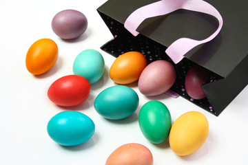 Colorful Easter eggs spilling out of the bag
