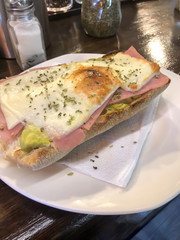 guacamole tostada, ham and cheese with a little oregano on top. 