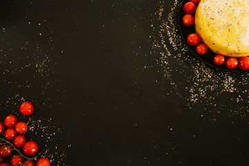 Culinary recipe. Italian cuisine. Homemade cheese cherry tomato arrangement on dark background.
