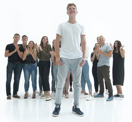Fototapeta na wymiar casual guy standing in front of a group of diverse young people