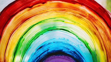 Close-up photo of painting rainbow on window