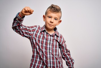 Young little caucasian kid with blue eyes wearing elegant shirt standing over isolated background Strong person showing arm muscle, confident and proud of power