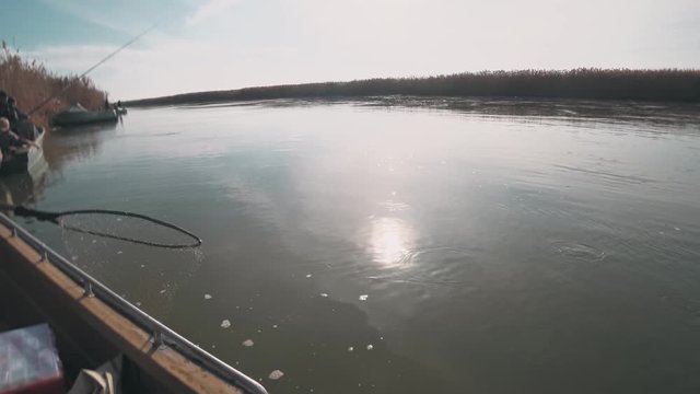 Fisherman caught on a spinning predatory catfish