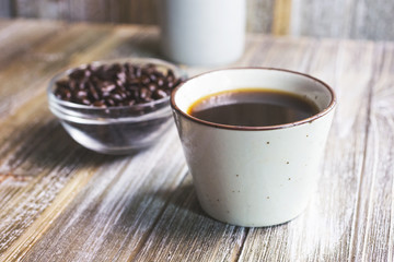A view of Japanese style coffee, with roasted coffee beans, in a restaurant or kitchen setting.