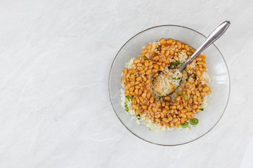 Cooked beans with rice salad served in the bowl with copy space