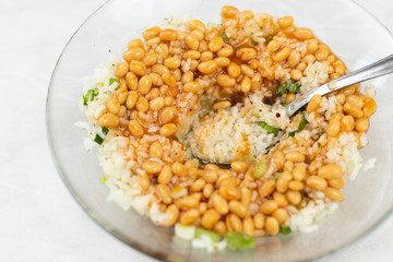 Cooked beans with rice salad served in the bowl