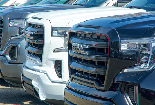 GMC new 2020 trucks in a line at dealership
