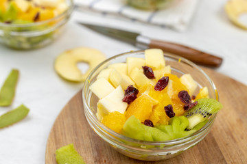 Fruit salad whipped cream flat lay white marble table