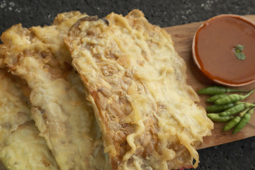 Gorengan tempe, Indonesian fried tempe snack, served with sambal or chili sauce and chilli pepper