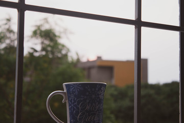 cup of coffee on window
