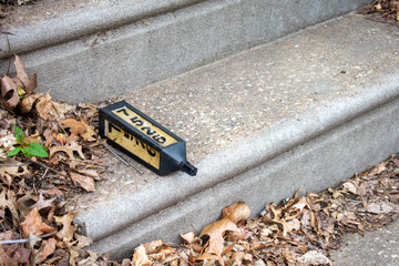A Broken Address Sign on a Step