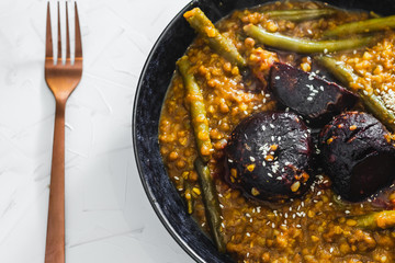 plant-based food, spicy vegetable curry with oven roasted whole beetroots