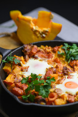 Spanish migas with pumpkin and meat