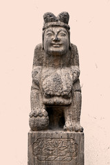 Stone pillar sculpture of ancient Chinese figures riding Lions