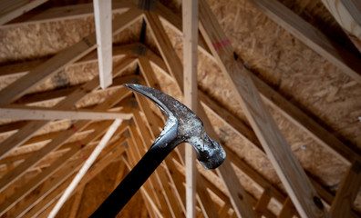 Hammer with house rafters 