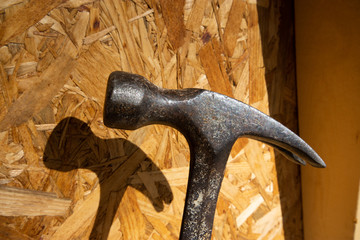 Hammer with wood background