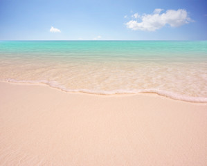 Fototapeta na wymiar Sea sand and sky in beautiful summer beach background