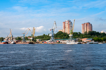 Fototapeta na wymiar Russia, Khabarovsk, August 2019: loading and unloading Port on the Bank of the Amur river in the city of Khabarovsk in the summer