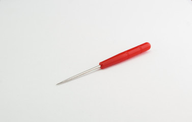 sharp awl with a red handle on a white background