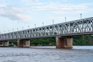 Fototapeta premium Russia, Khabarovsk, August 2019: Road bridge on the Amur river in the city of Khabarovsk in the summer