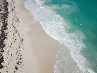 View from the bird-eye to the beautiful turquoise ocean and sandy beach, Caribbean sea, shot on  a drone