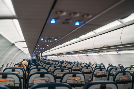 Empty airplane inside with small number of passengers, removal of citizens from other countries in connection with coronavirus covid-19.