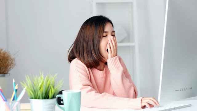 Working from home, Young asian woman yawn as exhausted from working with computer at home office, Asia girl overworked from study online class, Female people business, education technology lifestyle