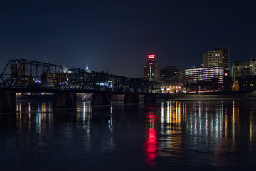 Fototapeta na wymiar Night view of Harrisburg, PA across the Susquehanna River from City Island in winter