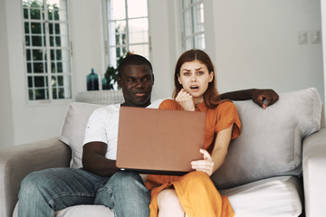 young couple using laptop