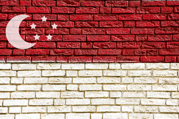Colorful background and texture depiction of country flag on a brick wall. 
