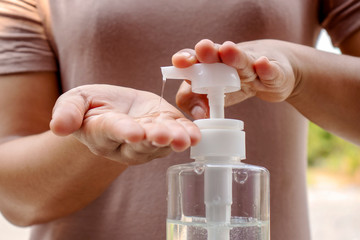 Women's hands are pressing the hand wash gel for Coronavirus or covid-19 prevention for the concept of health care and disease prevention.