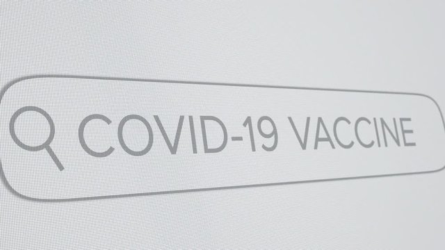Covid-19 Vaccine Typed in Search Engine Bar on Digital Screen