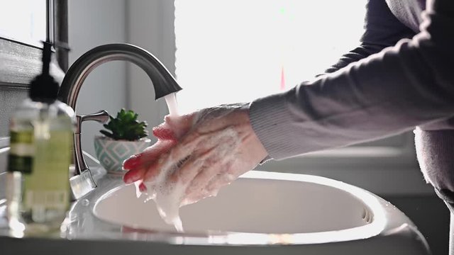 woman washing hands slow motion