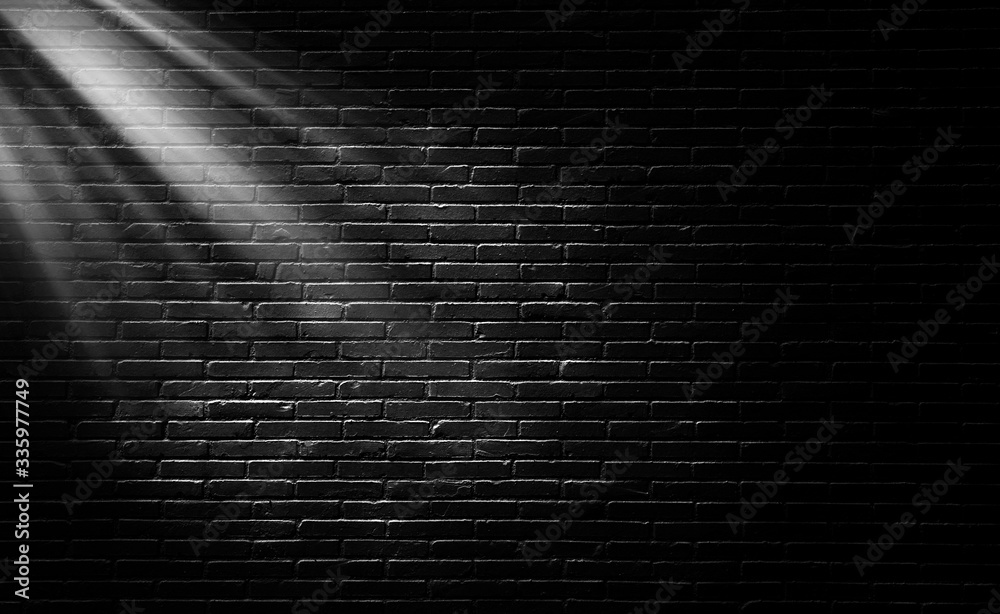 Wall mural abstract image of empty space black brick wall grunge texture background with light shading on wall.
