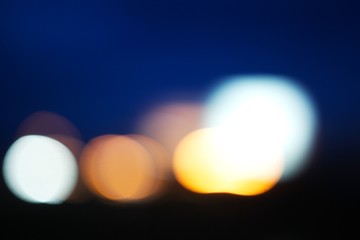 Blurred lights against a night sky