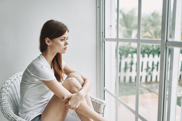 Obraz na płótnie Canvas young woman in the window