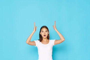 Fototapeta premium happy young woman with arms raised