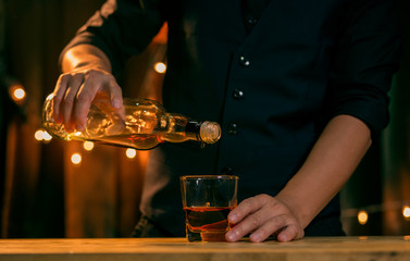 bartender pouring cocktail
