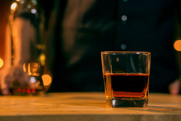 Barman pouring whiskey whiskey glass beautiful night