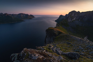 Midnight sun view from top of Hesten peak in Senja island in summer season, Nordland Norway, Scandinavia
