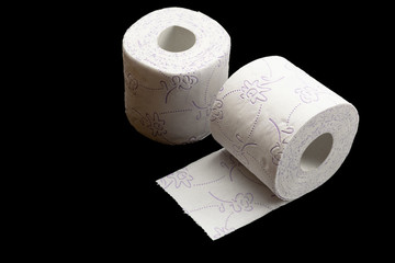 Soft tissue paper isolated on black background. Soft Toilet paper roll for bathroom. Cleaning concept product photograph for advertising