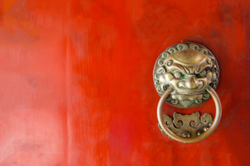 The red old door in front of Buddha Tooth Relic Temple, Singapore.