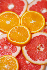Fototapeta na wymiar Oranges and grapefruits, chopped