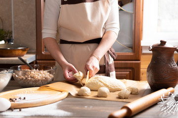 Cute Woman cooks delicious food in the kitchen