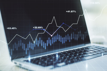 Double exposure of abstract creative financial chart on modern laptop background, research and strategy concept