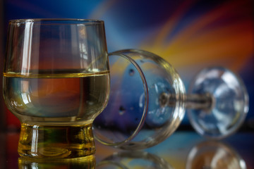Glass on a bright blue and orange background.