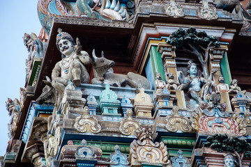 Hindu temple in Tamil Nadu, South India.  Sculptures on Hindu temple gopura (tower), sculpture of...